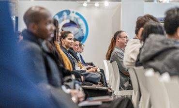 Des visiteurs assis assistant à une conférence sur la gestion de l'identité digitale et la cybersécurité à TRUSTECH
