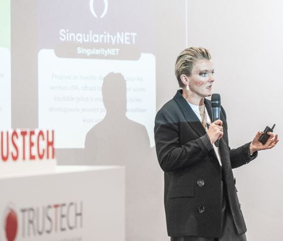Karen JOUVE from Doors3 resenting a project related to Web3 and banking services on stage during the TRUSTECH conference programme.