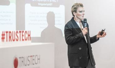 Karen JOUVE from Doors3 resenting a project related to Web3 and banking services on stage during the TRUSTECH conference programme.