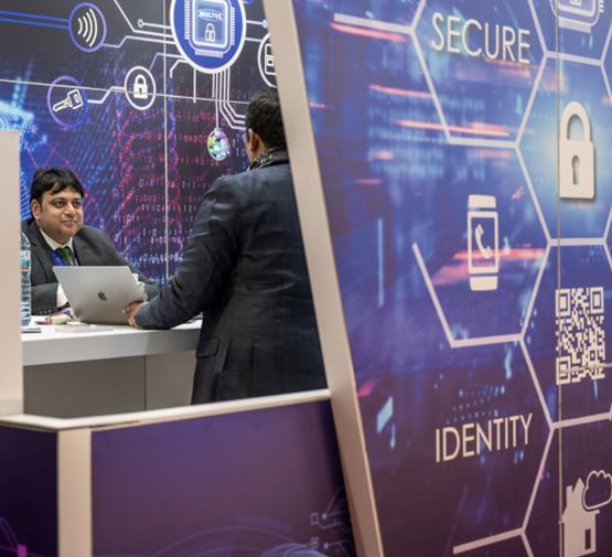 People discussing on a stand dedicated to digital security