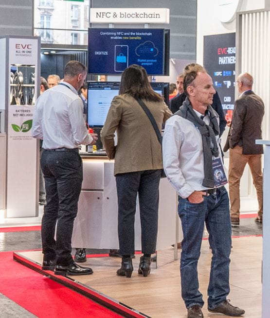 Booth presenting blockchain and NFC-based payment solutions at TRUSTECH.
