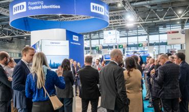 Visitors discussing on the HID booth showcasing digital identity solutions at TRUSTECH