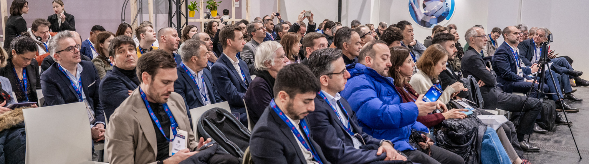 Professional audience attending a conference on payment & the European wallet at TRUSTECH 2024, with a large number of focused participants.