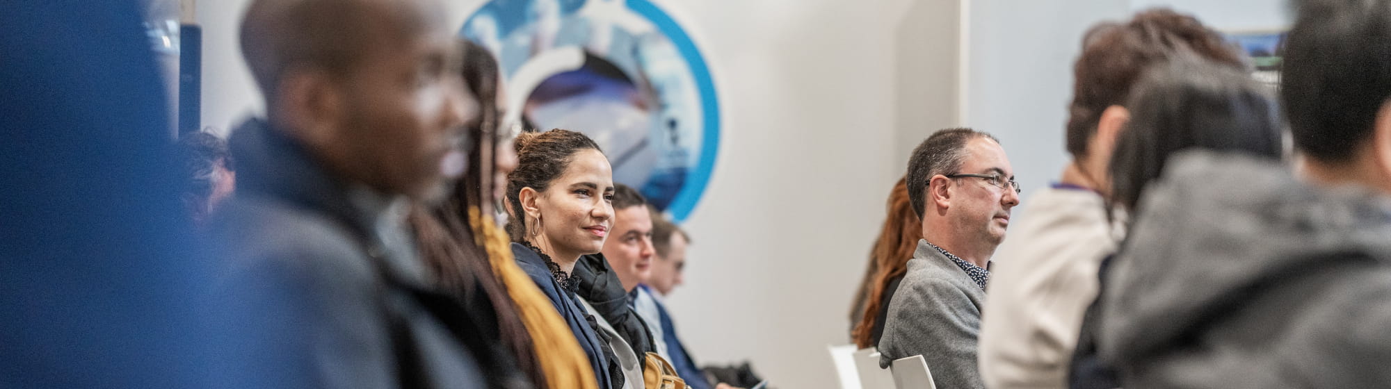 Attentive audience during a TRUSTECH conference focused on Web3 and banking topics.