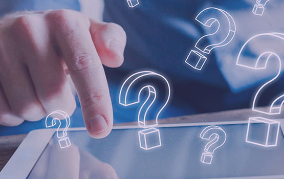 A hand holding a tablet with question marks