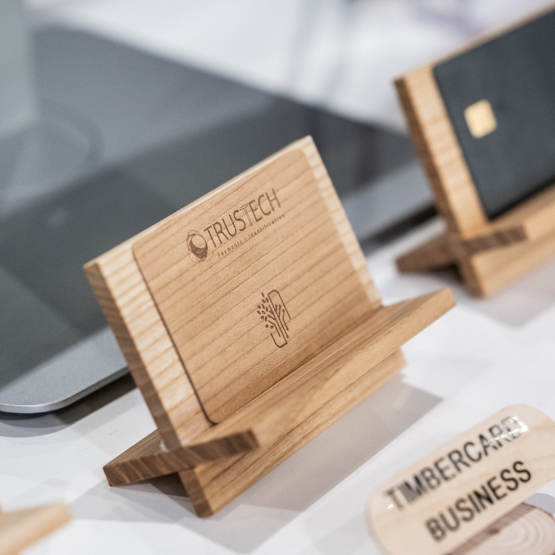 Wooden smart card displayed at TRUSTECH showcasing a sustainable contactless payment solution