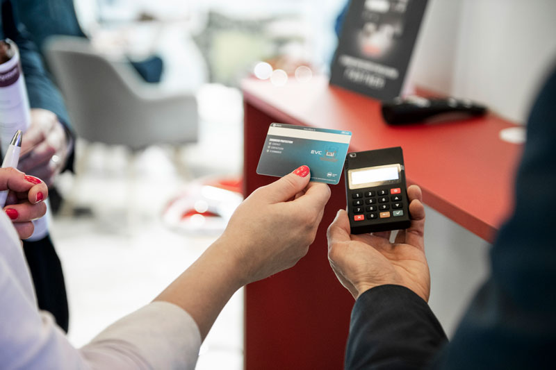 A woman doing a contactless payment